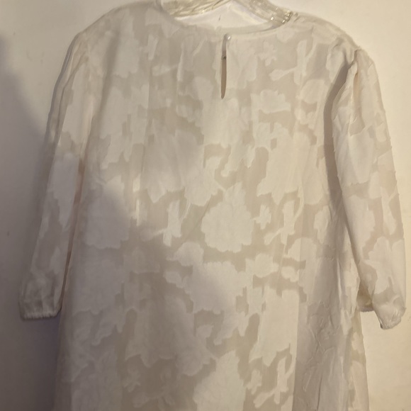 Zulily top in XXL has embossed flowers It’s  lining the sleeve are see-threw - Picture 8 of 15